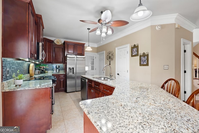 kitchen featuring light tile patterned floors, stainless steel appliances, tasteful backsplash, ornamental molding, and a sink