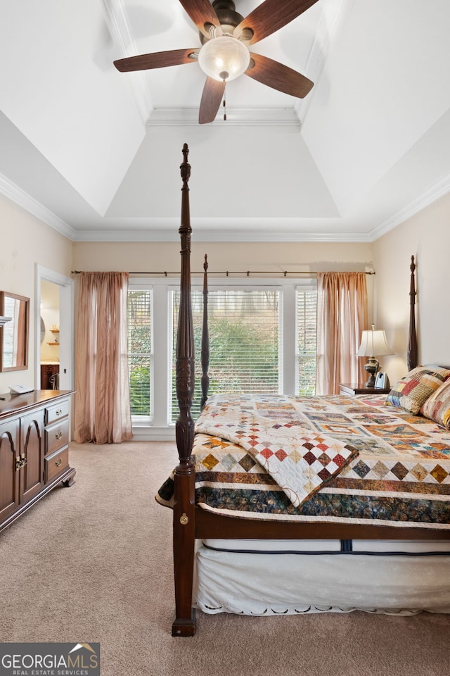 bedroom featuring vaulted ceiling, carpet floors, ornamental molding, and ceiling fan