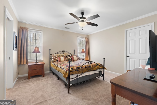 bedroom with baseboards, visible vents, a ceiling fan, light colored carpet, and crown molding