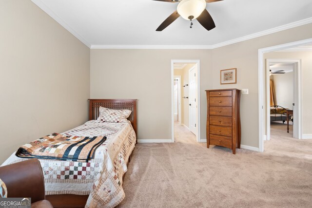 carpeted bedroom with baseboards, a ceiling fan, and crown molding