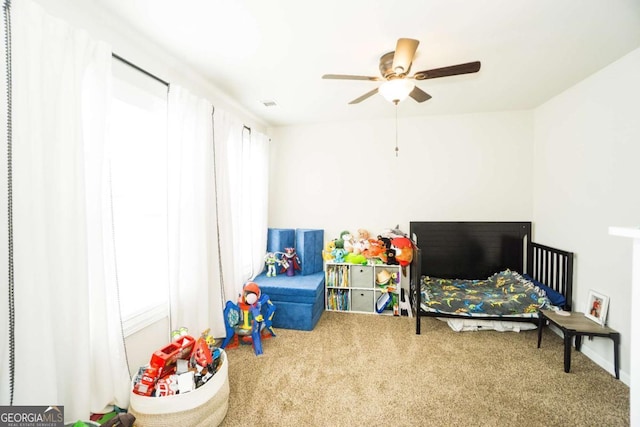 carpeted bedroom with ceiling fan