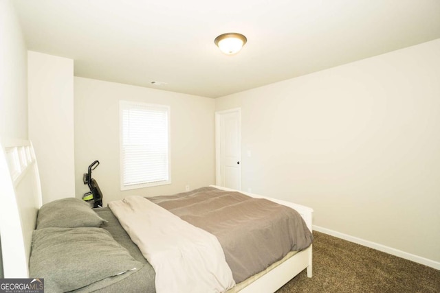 bedroom featuring carpet, visible vents, and baseboards