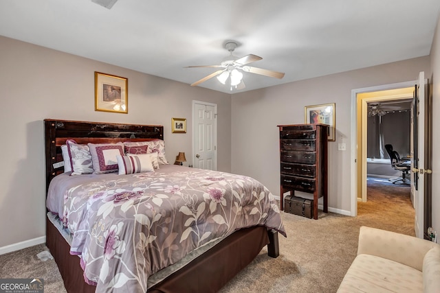 bedroom with carpet, baseboards, and a ceiling fan