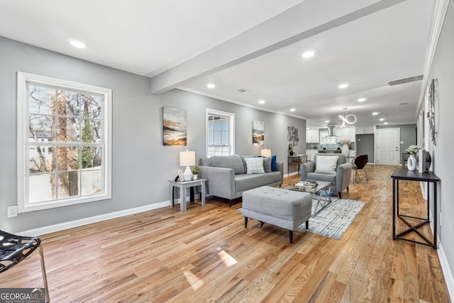 living area featuring recessed lighting, visible vents, ornamental molding, light wood-type flooring, and baseboards