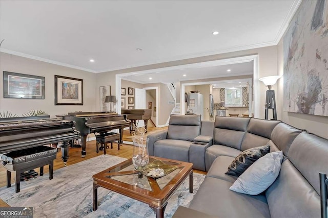 living area with light wood finished floors, stairway, recessed lighting, and crown molding