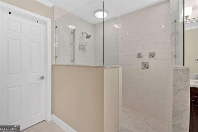 full bathroom featuring walk in shower and vanity