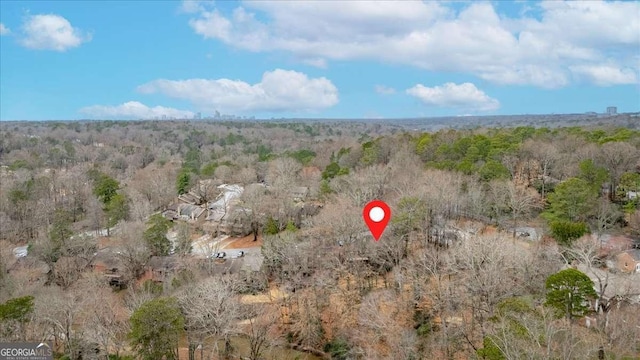 aerial view featuring a view of trees