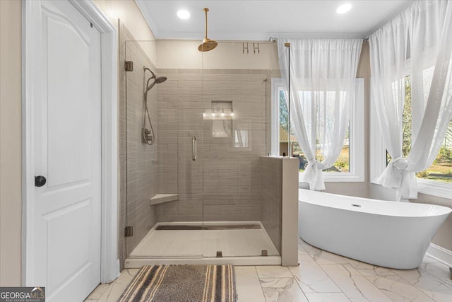 full bath with a stall shower, recessed lighting, marble finish floor, and a soaking tub