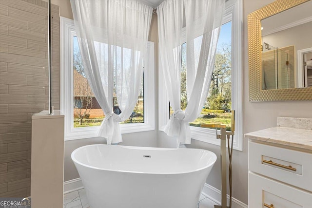 full bathroom featuring a soaking tub, marble finish floor, tiled shower, and vanity