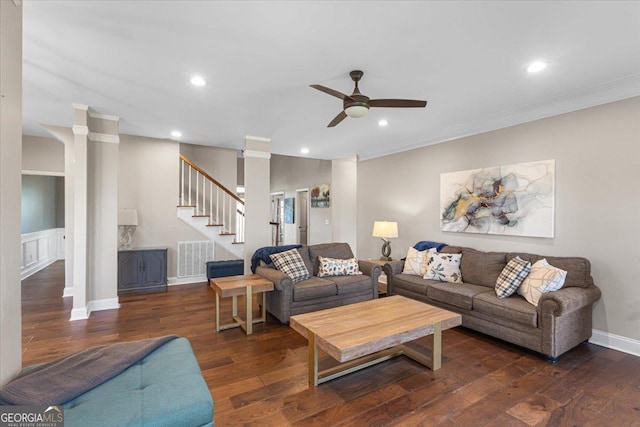 living area with dark wood-style flooring, recessed lighting, visible vents, stairway, and ornamental molding