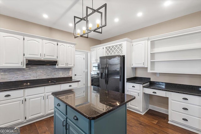 kitchen featuring white cabinets, under cabinet range hood, and black appliances