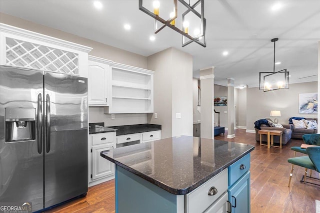 kitchen with open shelves, open floor plan, white cabinets, stainless steel fridge with ice dispenser, and hardwood / wood-style flooring