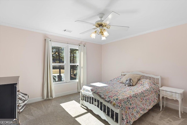 bedroom with baseboards, ornamental molding, visible vents, and light colored carpet