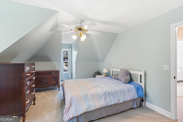 carpeted bedroom with lofted ceiling, ceiling fan, and baseboards