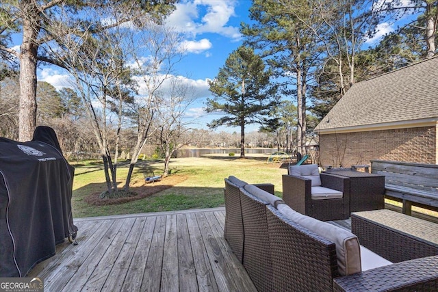 wooden terrace with an outdoor hangout area, a lawn, and a grill