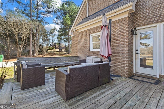 wooden deck with an outdoor living space