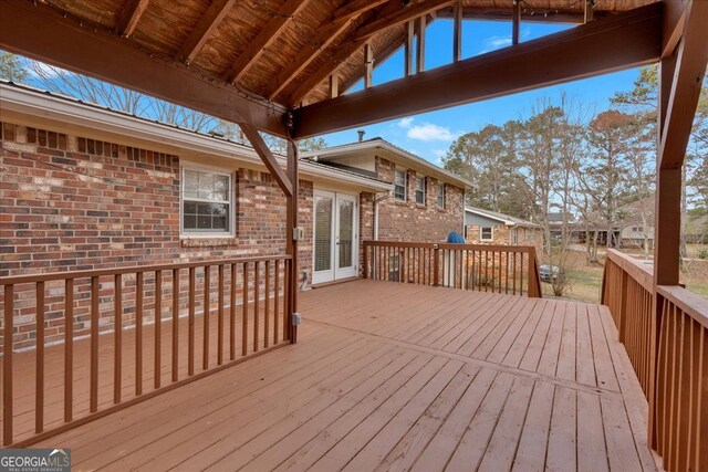 wooden deck featuring french doors