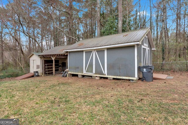 view of shed featuring fence