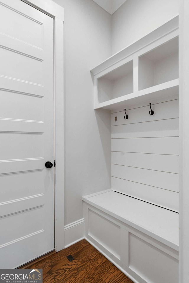 mudroom with dark wood-style floors