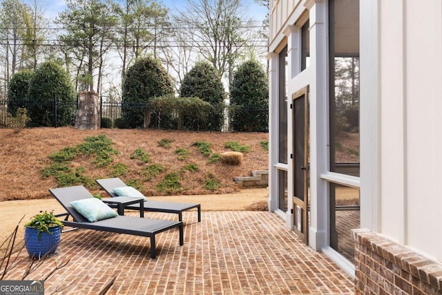 view of patio / terrace featuring fence