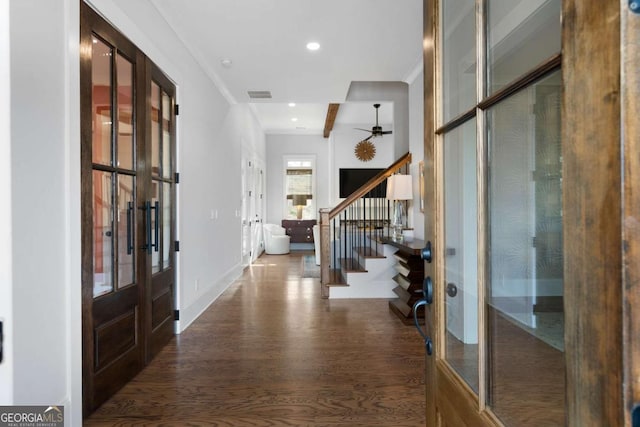 foyer entrance featuring french doors, visible vents, stairway, and wood finished floors