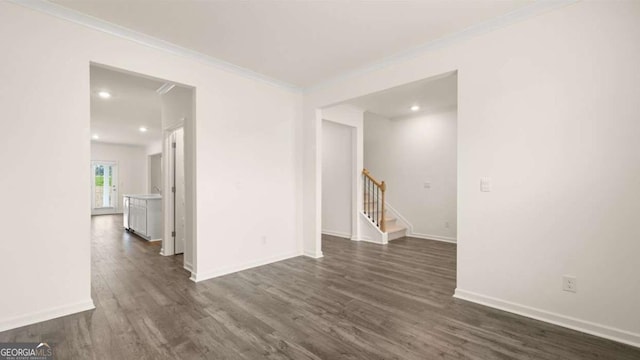 1039 Blue Juniper Cir, Loganville, GA 30052 - empty room featuring dark wood-style flooring, crown molding, stairs, and recessed lighting