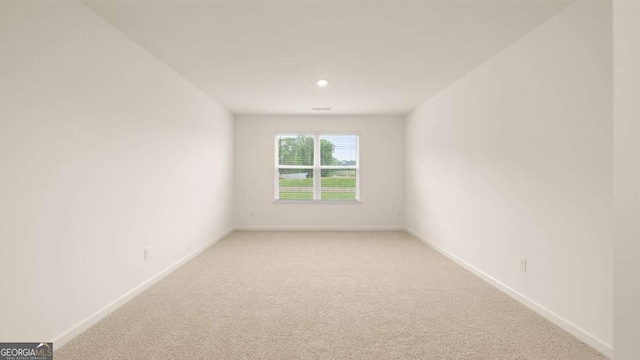 1039 Blue Juniper Cir, Loganville, GA 30052 - empty room with light carpet and recessed lighting