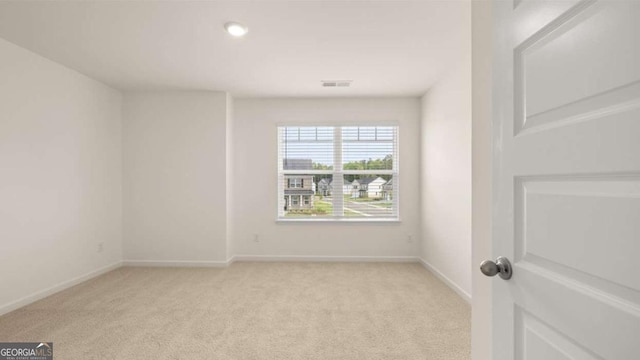 1039 Blue Juniper Cir, Loganville, GA 30052 - unfurnished room featuring light colored carpet and recessed lighting