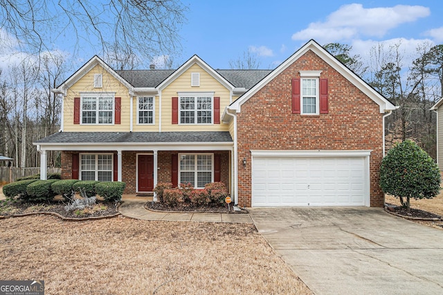 traditional home with an attached garage, covered porch, brick siding, driveway, and roof with shingles