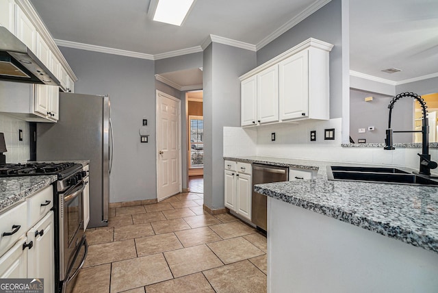 kitchen featuring crown molding, stainless steel appliances, a sink, light stone countertops, and wall chimney exhaust hood