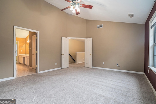 unfurnished bedroom featuring visible vents, light carpet, and baseboards