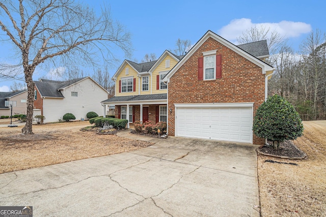 traditional home with a garage, driveway, brick siding, and a shingled roof