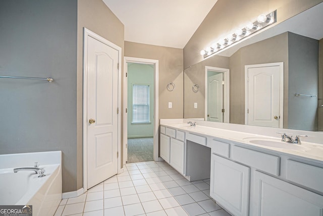 full bath featuring tile patterned floors, a garden tub, a sink, and double vanity