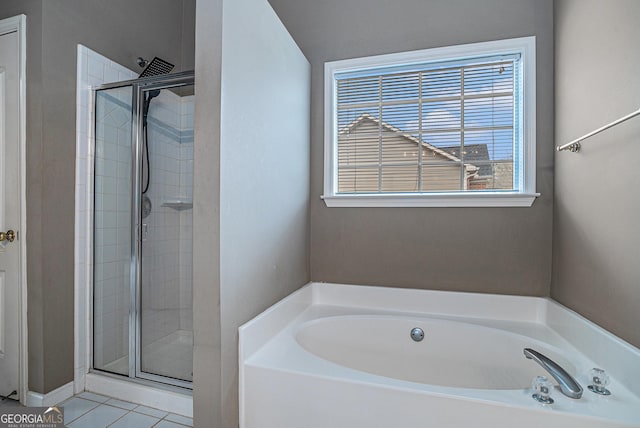 full bath with a stall shower, a garden tub, and tile patterned floors