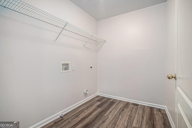 washroom featuring dark wood-style flooring, hookup for a washing machine, gas dryer hookup, electric dryer hookup, and laundry area