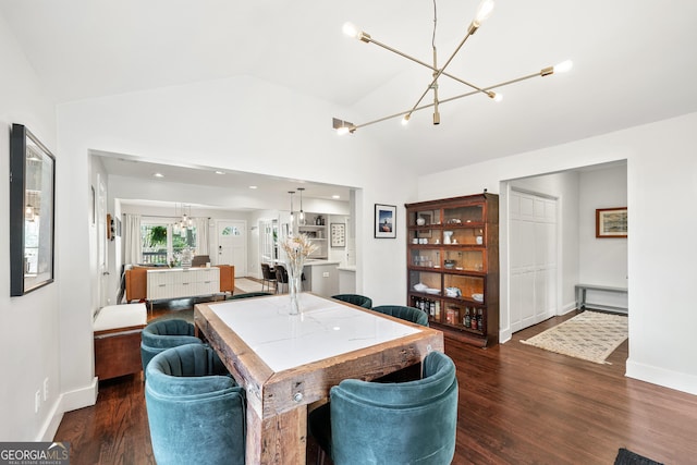 interior space with lofted ceiling, wood finished floors, baseboards, and a chandelier