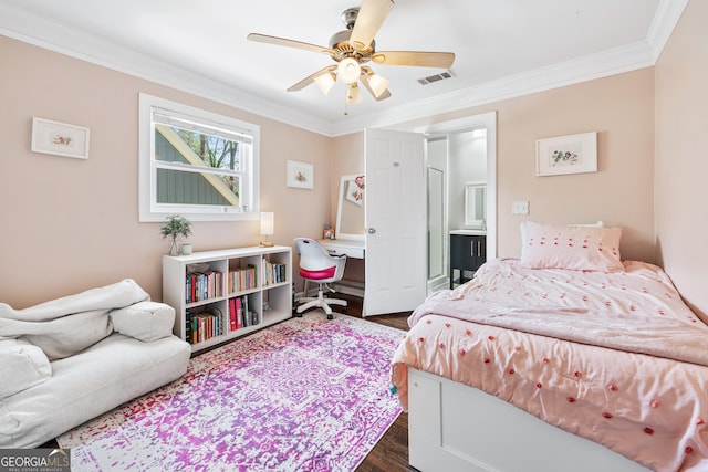 bedroom featuring ceiling fan, visible vents, dark wood finished floors, and crown molding