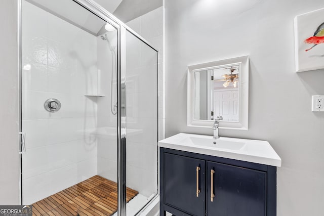 bathroom featuring a stall shower and vanity