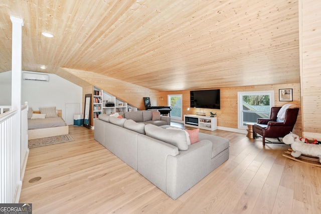 living area with a wealth of natural light, hardwood / wood-style flooring, a wall mounted AC, wood ceiling, and vaulted ceiling