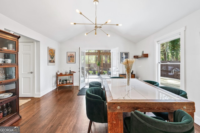 home office with dark wood-type flooring, a notable chandelier, a wealth of natural light, and vaulted ceiling