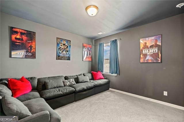 living room featuring carpet floors and baseboards