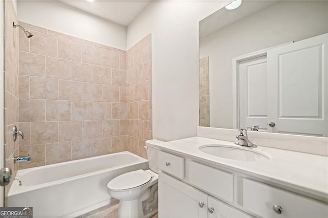 full bath with shower / tub combination, toilet, and vanity