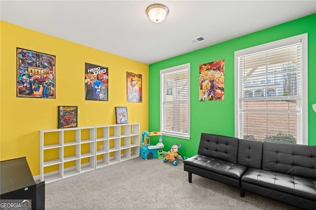 playroom with carpet flooring and visible vents