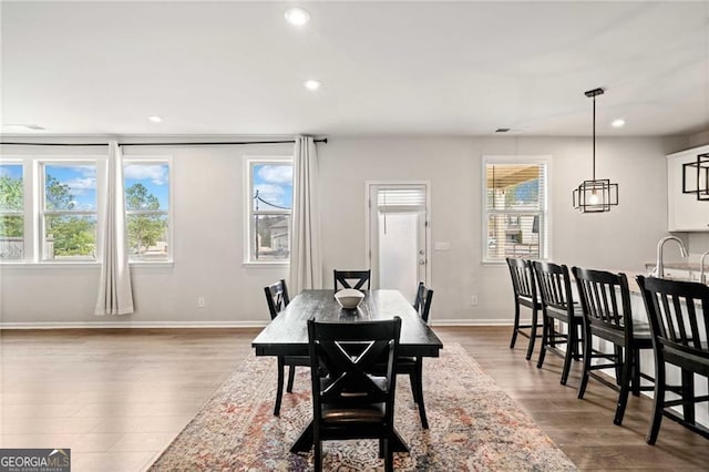dining area featuring recessed lighting, baseboards, visible vents, and wood finished floors