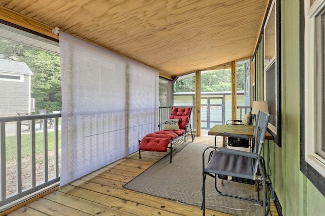 sunroom / solarium featuring wood ceiling and vaulted ceiling