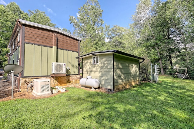 view of outdoor structure with ac unit and an outdoor structure