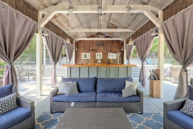 living room featuring wood-type flooring, wooden ceiling, wooden walls, and lofted ceiling with beams