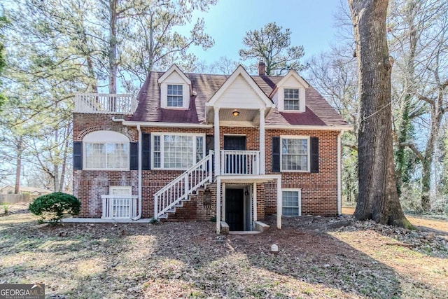 238 Howell Dr SW, Atlanta, GA 30331 - view of front of property with brick siding, stairs, and a chimney
