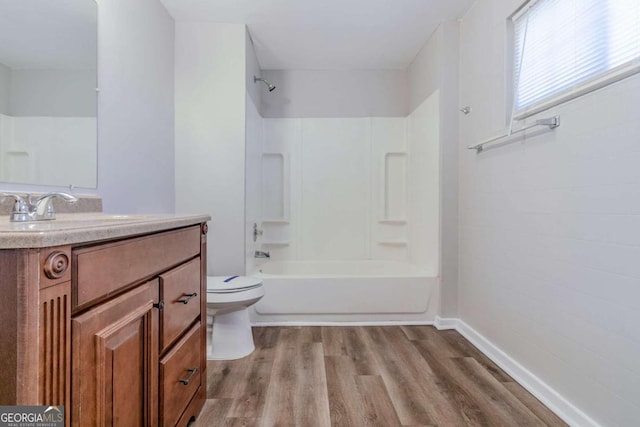 238 Howell Dr SW, Atlanta, GA 30331 - bathroom with wood finished floors, vanity, and shower / bath combination