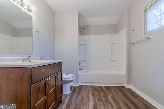 238 Howell Dr SW, Atlanta, GA 30331 - full bath with vanity, wood finished floors, and washtub / shower combination